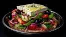 rustic greek “choriatiki” salad slices on flatbread rusks
